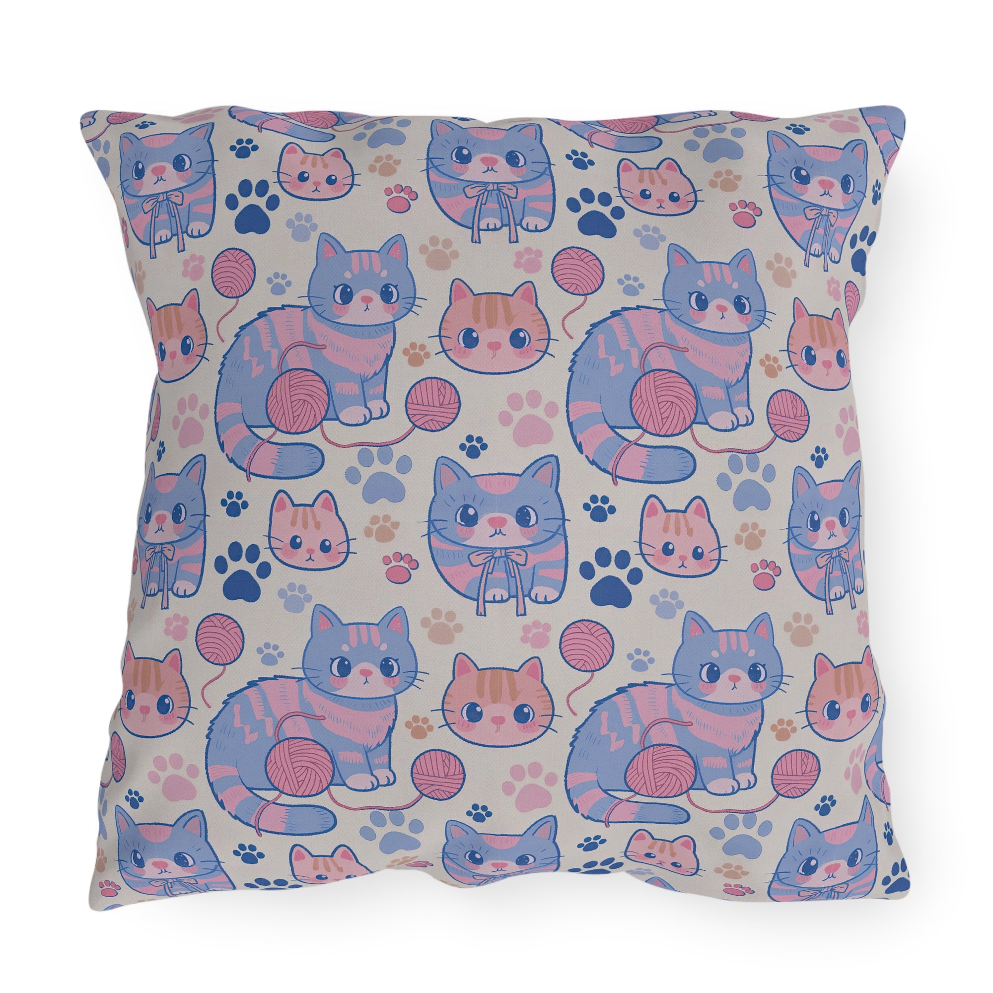 Outdoor Pillow - Sweet pastel blue and pink cartoon cats, cute kawaii style kittens with yarn and paw prints, charming and playful animal design, light cream background, delightful pet pattern